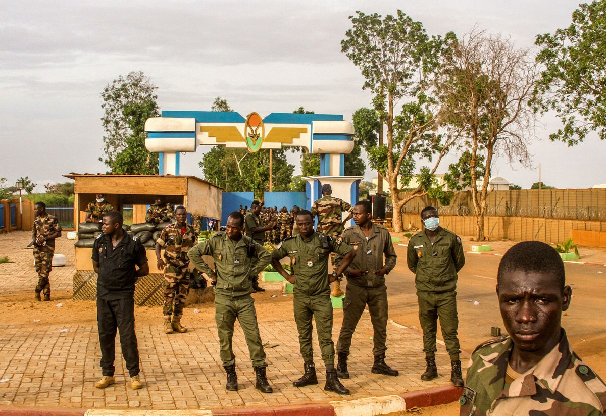 Niger's security forces stands guard as pro junta supporters take part in a demonstration in front of a French army base in Niamey, Niger.