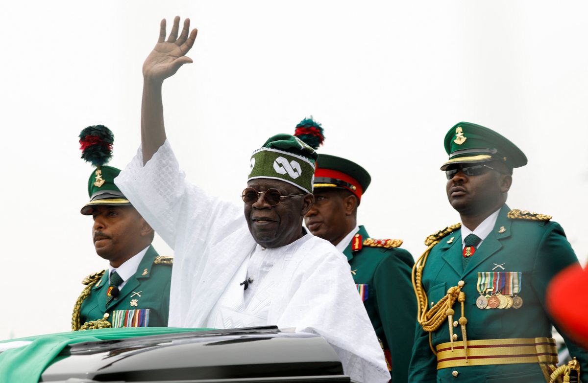 Nigeria's President Bola Tinubu waves at a crowd during his swearing-in ceremony in Abuja.