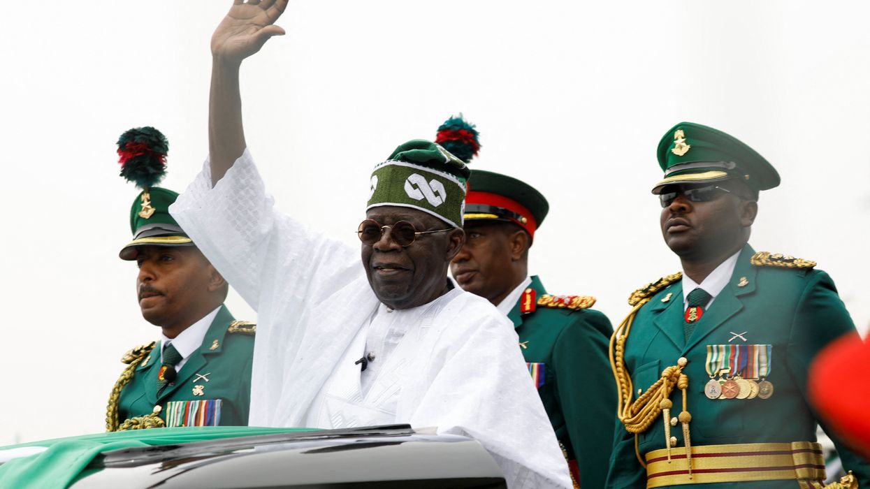 Nigeria's President Bola Tinubu waves at a crowd during his swearing-in ceremony in Abuja.