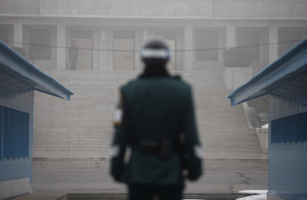 North Korean and South Korean troops stand guard in the "Truce Village" of Panmunjom in the DMZ.