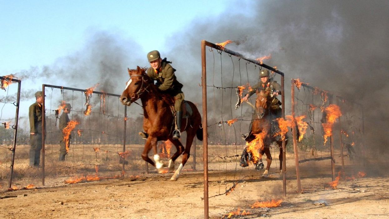 North Korean soldiers conduct military training at a drill field of the 534 military unit as the Supreme Commander of the North Korean People's Army (not pictured) visits to the unit at an undisclosed location in North Korea, in this undated picture released by KCNA November 5, 2008.