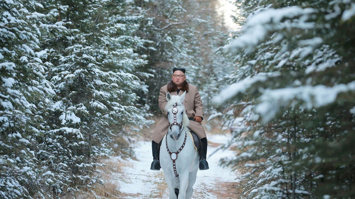 North Korean Supreme Leader Kim Jong Un rides a horse during snowfall in Mt. Paektu.