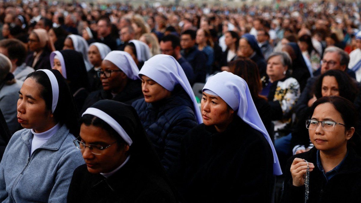 ​Nuns and faithful attend a rosary for Pope Francis, following the death of the pontiff, in St. Peter's square, at the Vatican, April 21, 2025. 