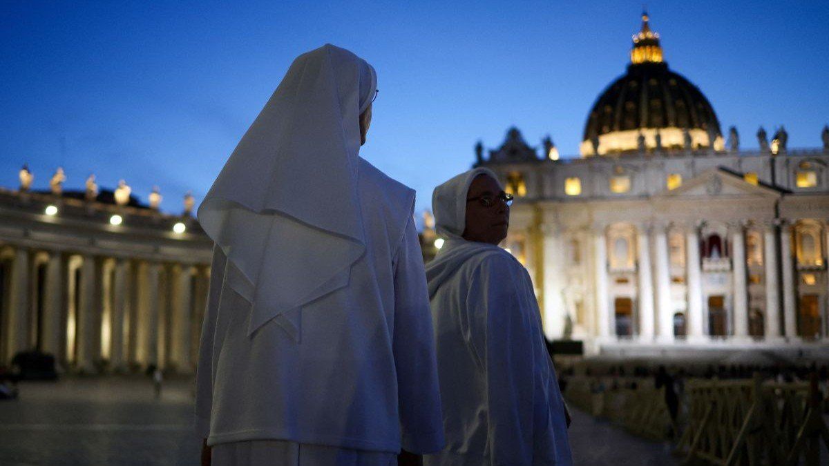 ​Nuns walk at St. Peter's Square, ahead of the conclave, at the Vatican, on May 6, 2025.