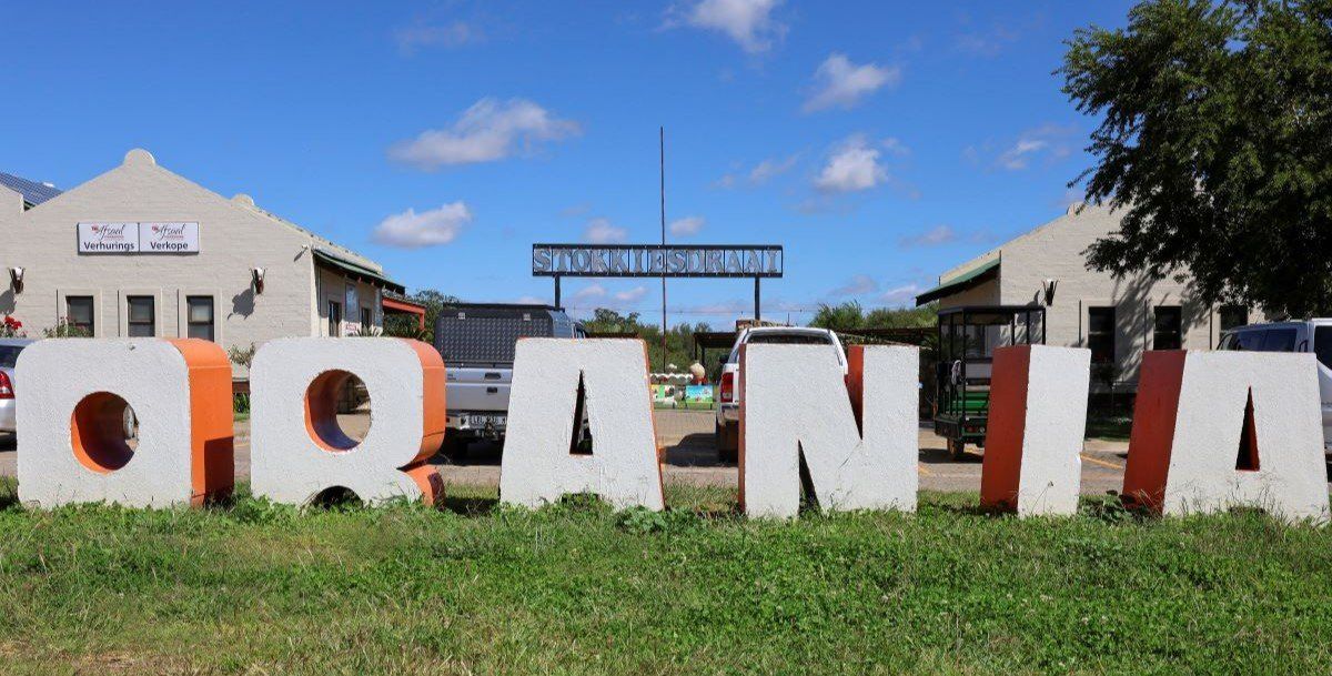 ​Orania town sign in front of local shopping centre is pictured in whites-only town of Orania, South Africa, April 1, 2025. 
