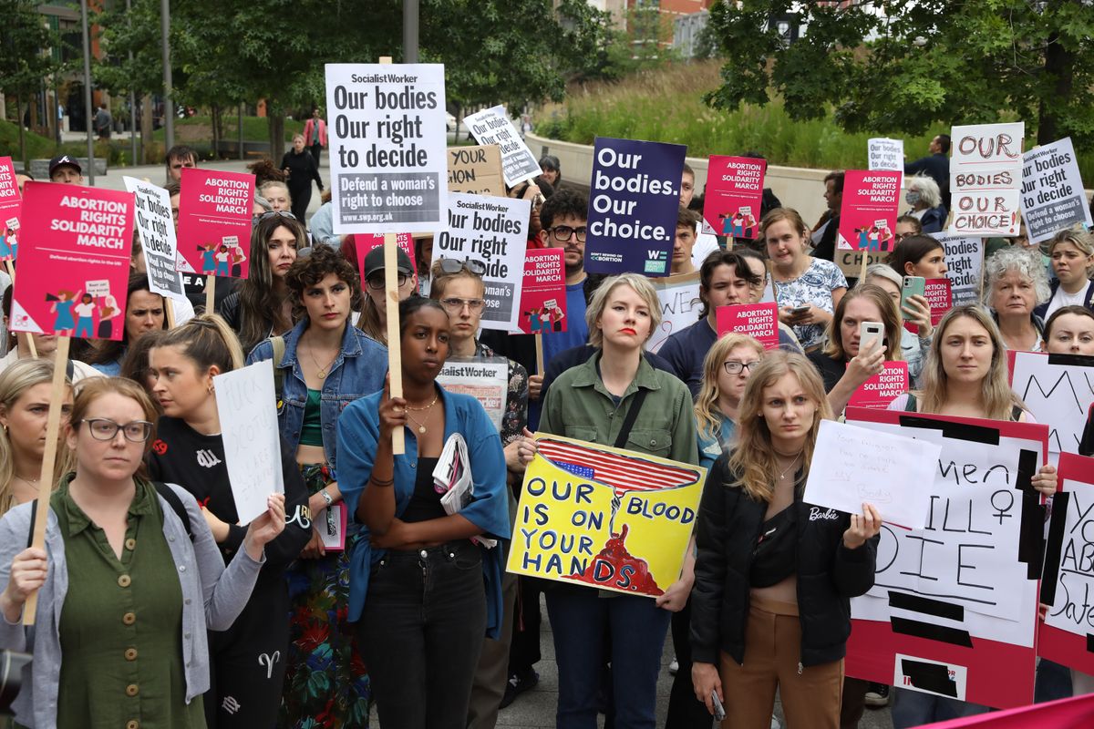 PA via Reuters Demonstrators gather outside the United States embassy