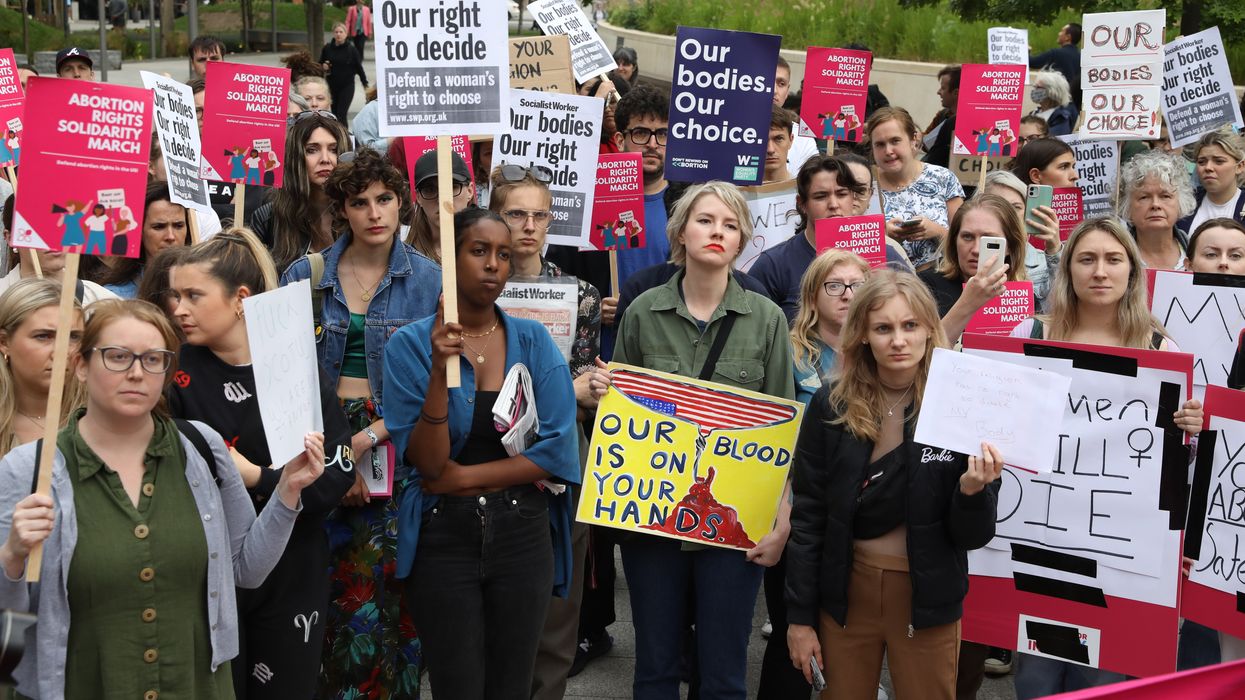 PA via Reuters Demonstrators gather outside the United States embassy
