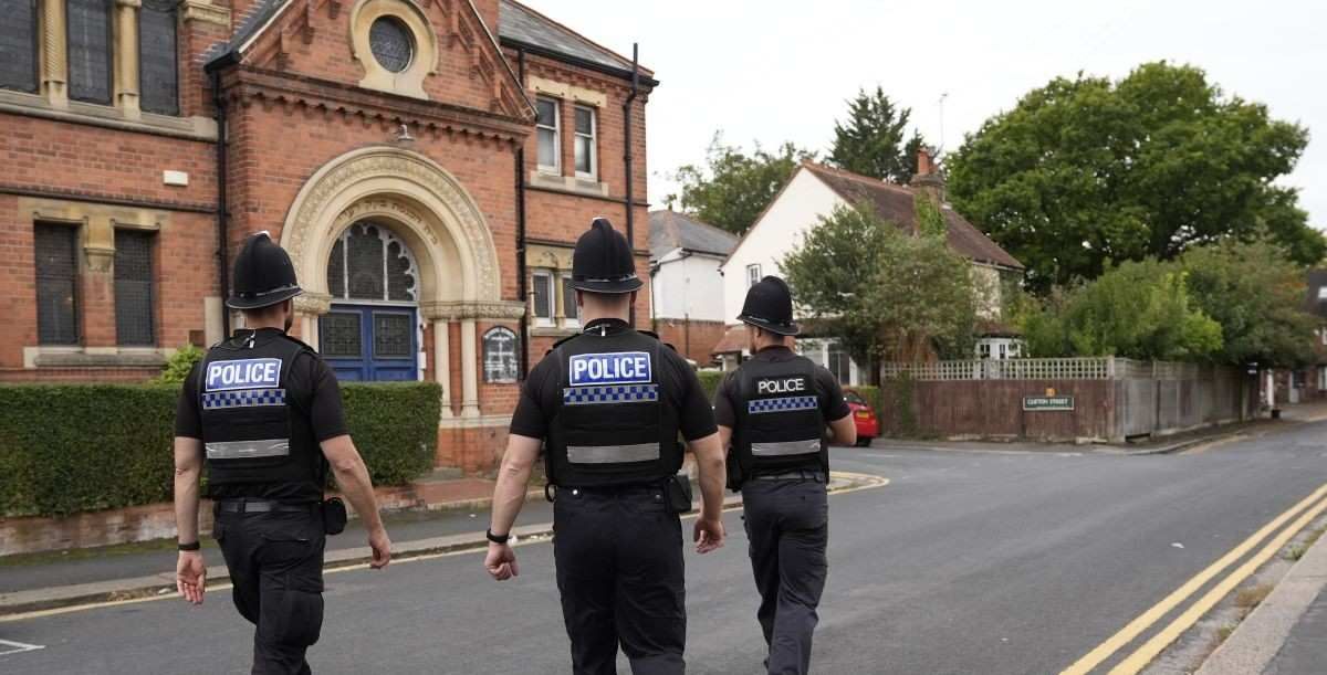 PA via Reuters Police officers on patrol outside the Reading Hebrew Congregation in Reading. 