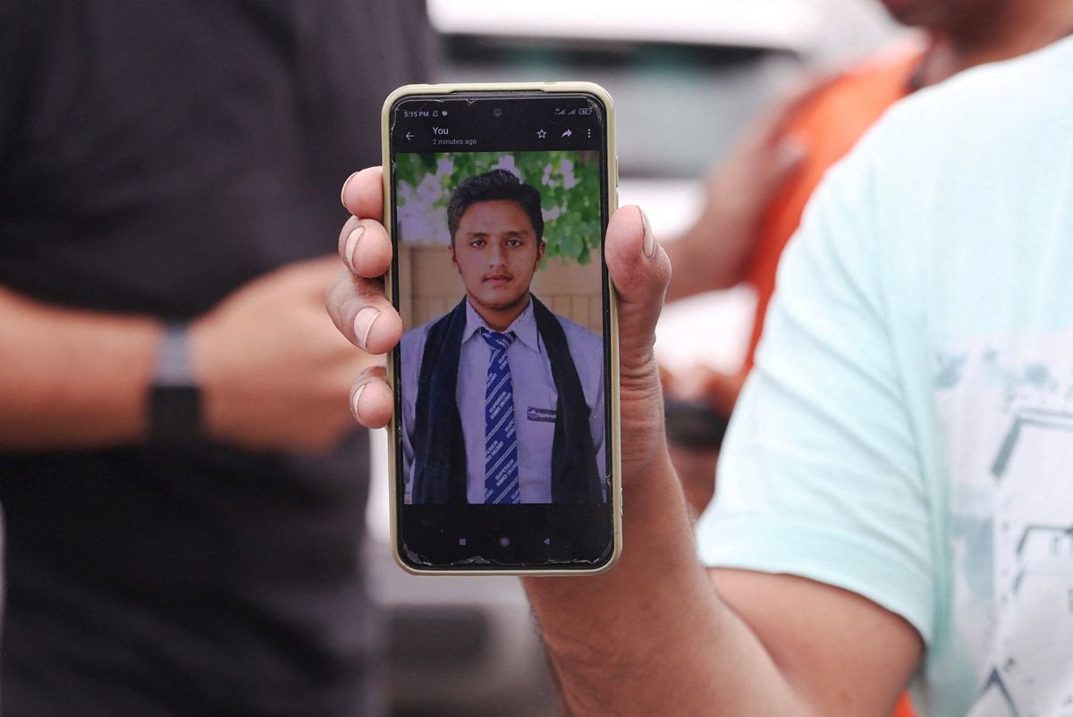 Pakistani Hassan Ali shows a photo of his brother who died in a shipwreck off the Greek coast. 