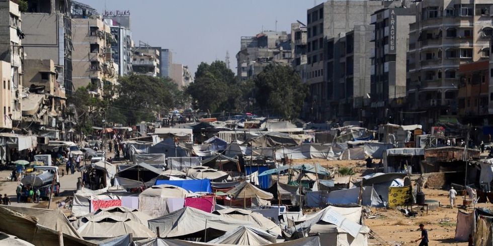 ​‏Palestinians, displaced by the Israeli military offensive, take shelter in a tent camp, amid an Israeli operation, in Gaza City, September 16, 2025. 