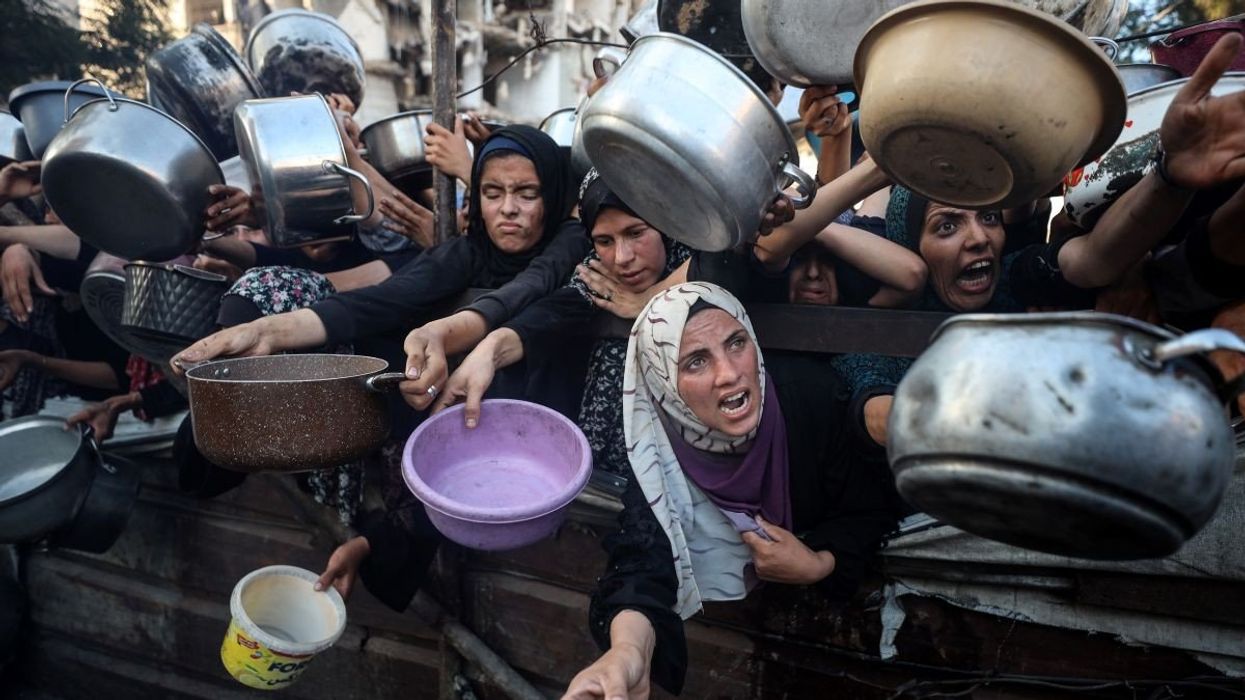 Palestinians gather at a food distribution point in Gaza City, on July 20, 2025.