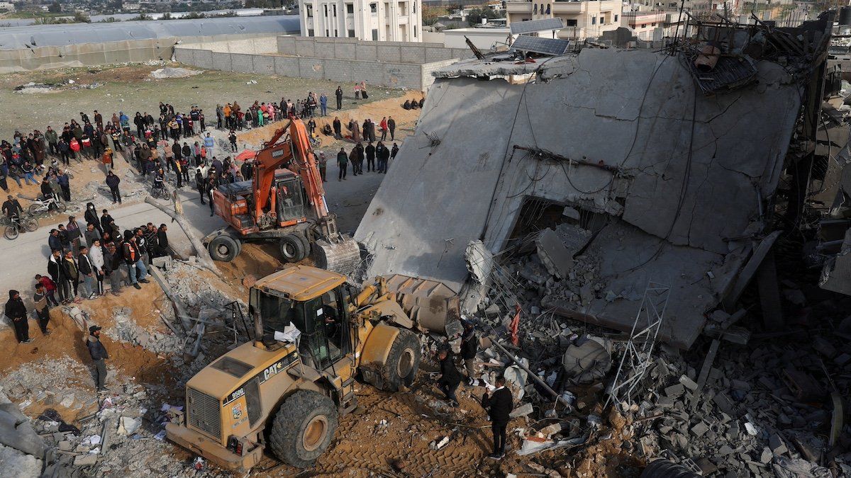 Palestinians inspect a house hit by an Israeli strike, in Rafah in the southern Gaza Strip February 16, 2024.