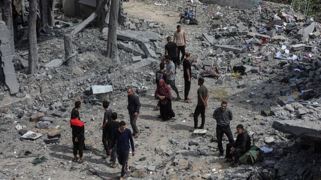 Palestinians inspect the site of an Israeli strike on a house, in Jabalia, in the northern Gaza Strip, on May 14, 2025.