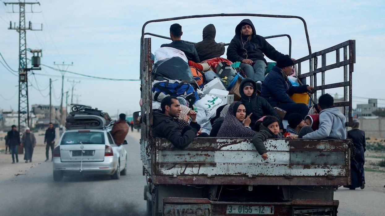 Palestinians leave Rafah in fear of an Israeli military operation in the southern Gaza Strip, on Feb. 13, 2024.
