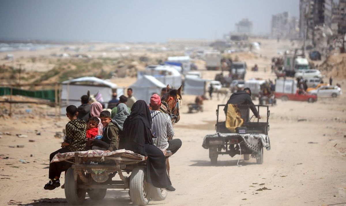 Palestinians travel in vehicles between the northern and southern Gaza Strip along the Rashid Road on April 2, 2025.  ​