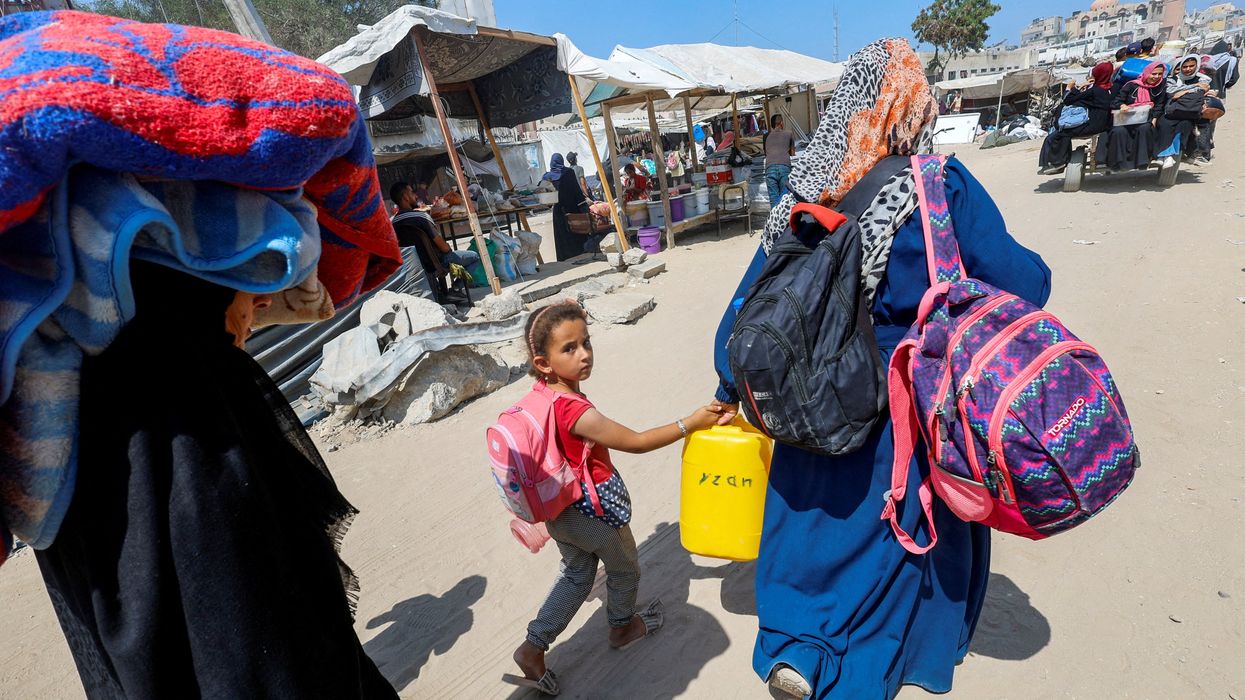 Palestinians, who fled the eastern part of Khan Younis after they were ordered by Israeli army to evacuate their neighborhoods, make their way, amid Israel-Hamas conflict, in Khan Younis in the southern Gaza Strip July 2, 2024.