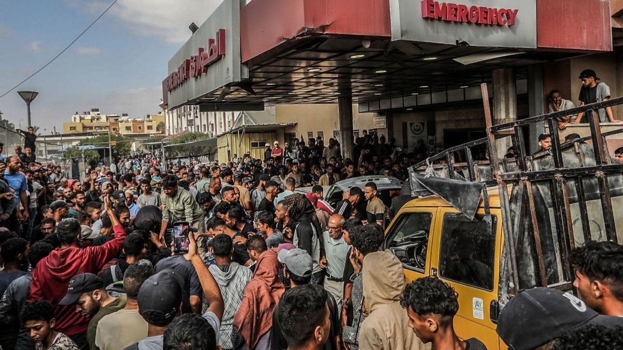 Palestinians wounded in an Israeli strike near a humanitarian aid distribution centre are rushed to Nasser Hospital in Khan Yunis.