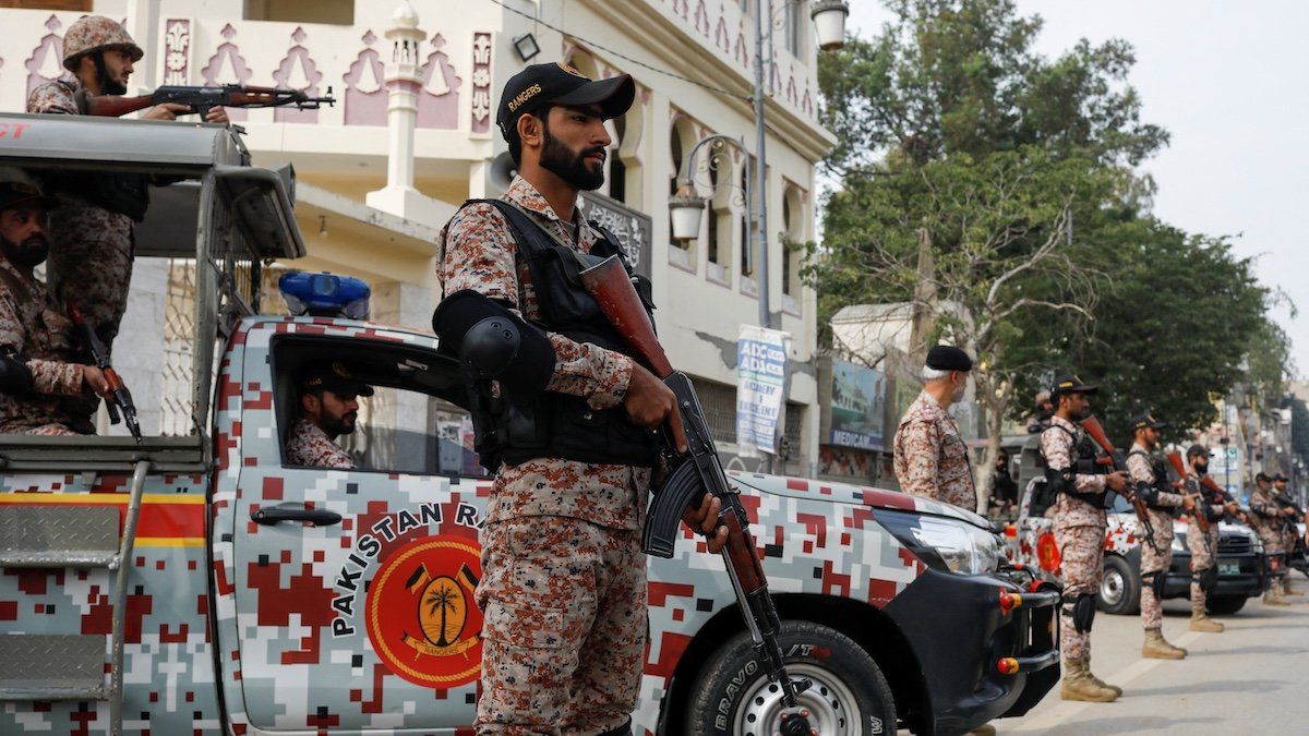 Paramilitary soldiers stand guard along a road, ahead of the general elections in Karachi, Pakistan February 7, 2024. 