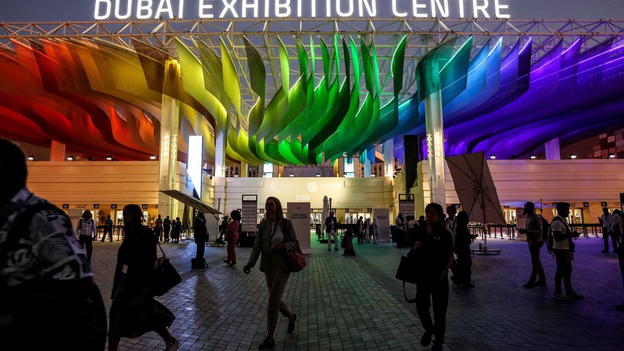 Participants enter the Dubai Exhibition Centre during the COP28, UN Climate Change Conference.