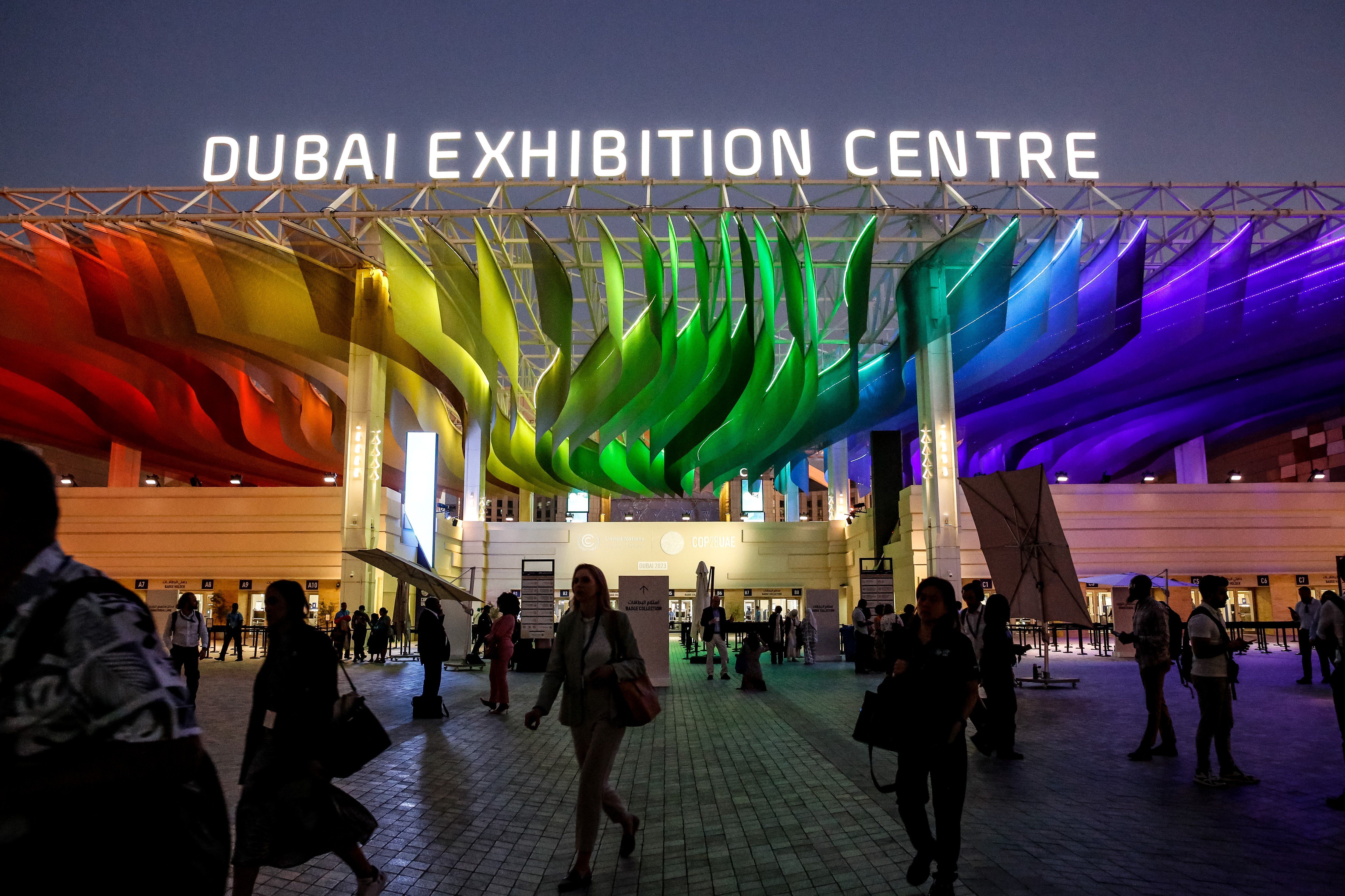 Participants enter the Dubai Exhibition Centre during the COP28, UN Climate Change Conference.