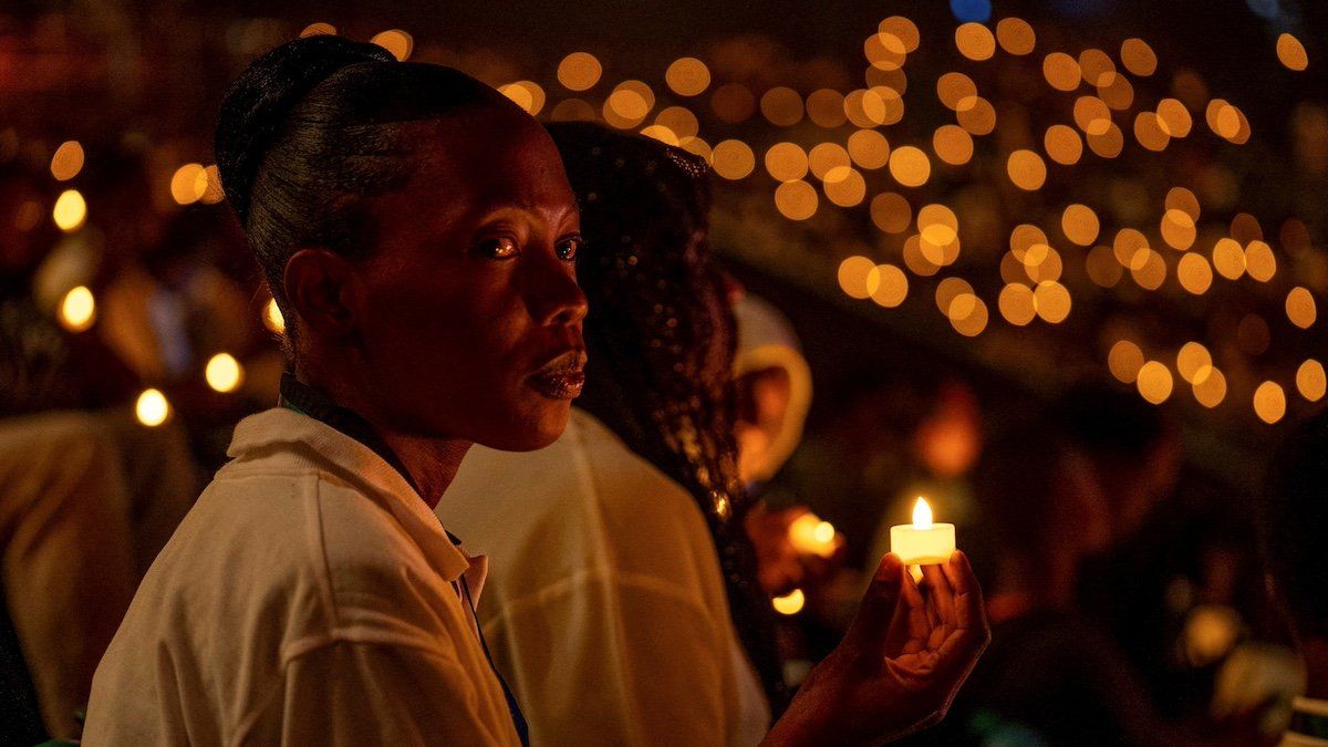​Participants hold a candle light night vigil during a commemoration event, known as "Kwibuka" (Remembering), as Rwanda marks the 30th anniversary of the 1994 Genocide, at the BK arena in Kigali, Rwanda April 7, 2024. 