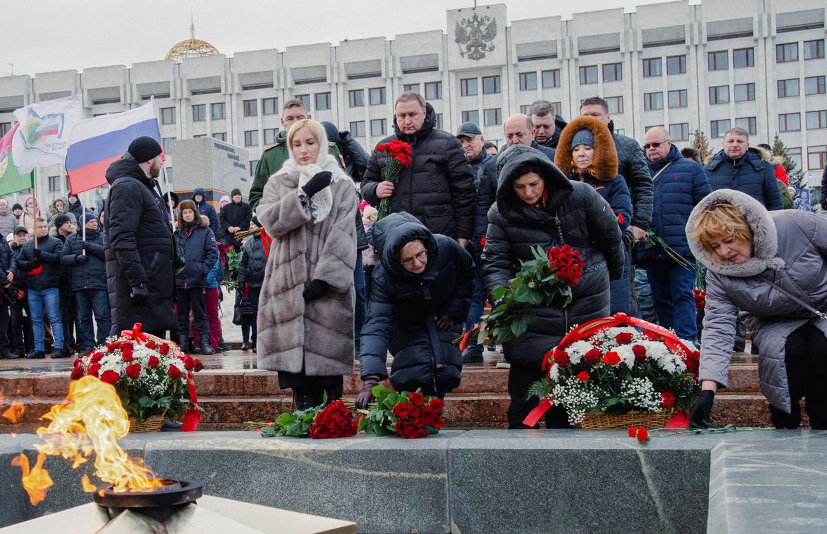 Participants lay flowers near the Eternal Flame memorial as they gather in Glory Square the day after Russia's Defense Ministry stated that 63 Russian servicemen were killed in a Ukrainian missile strike on their temporary accommodation in Makiivka.