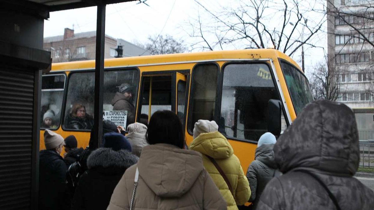Passengers enter a shared taxi in Dnipro, Ukraine, on January 8, 2026.