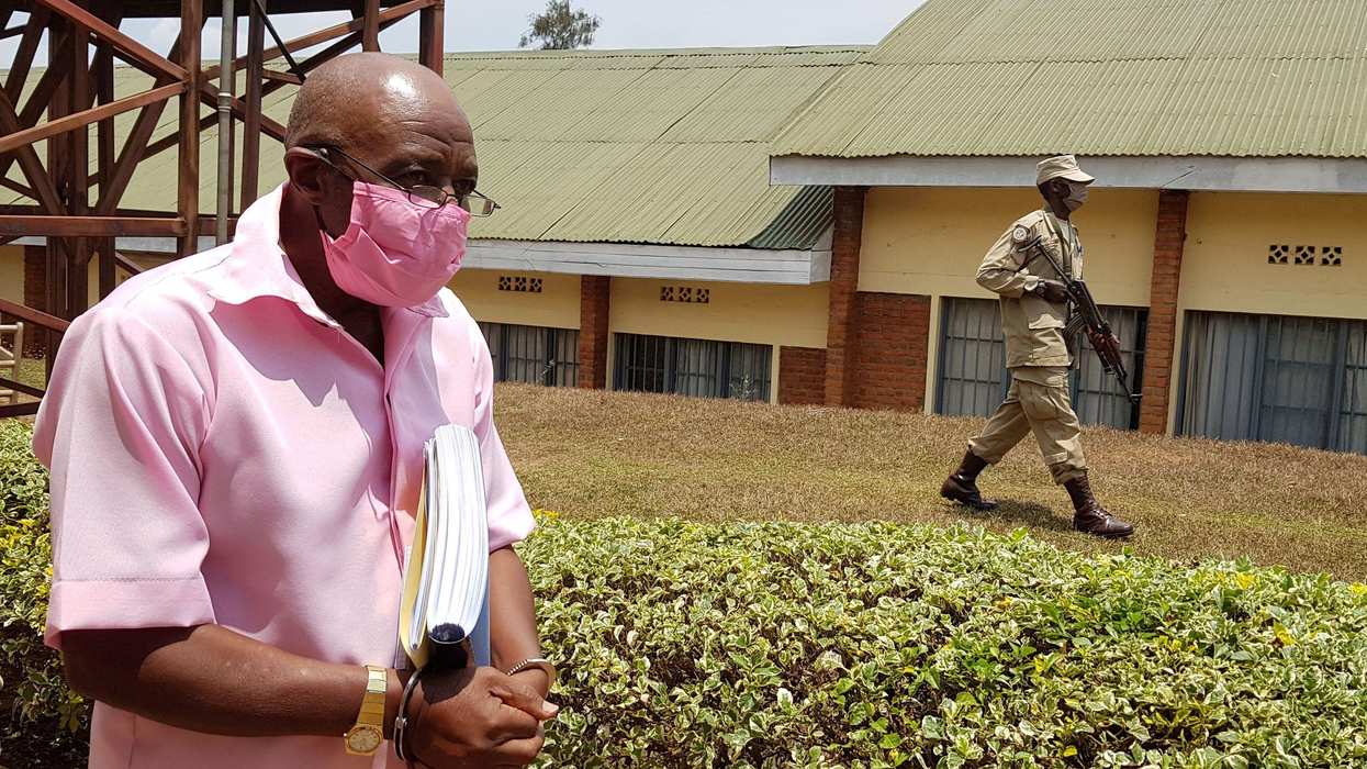 : Paul Rusesabagina, portrayed as a hero in a Hollywood movie about Rwanda's 1994 genocide, is escorted in handcuffs from the courtroom in Kigali, Rwanda September 25, 202