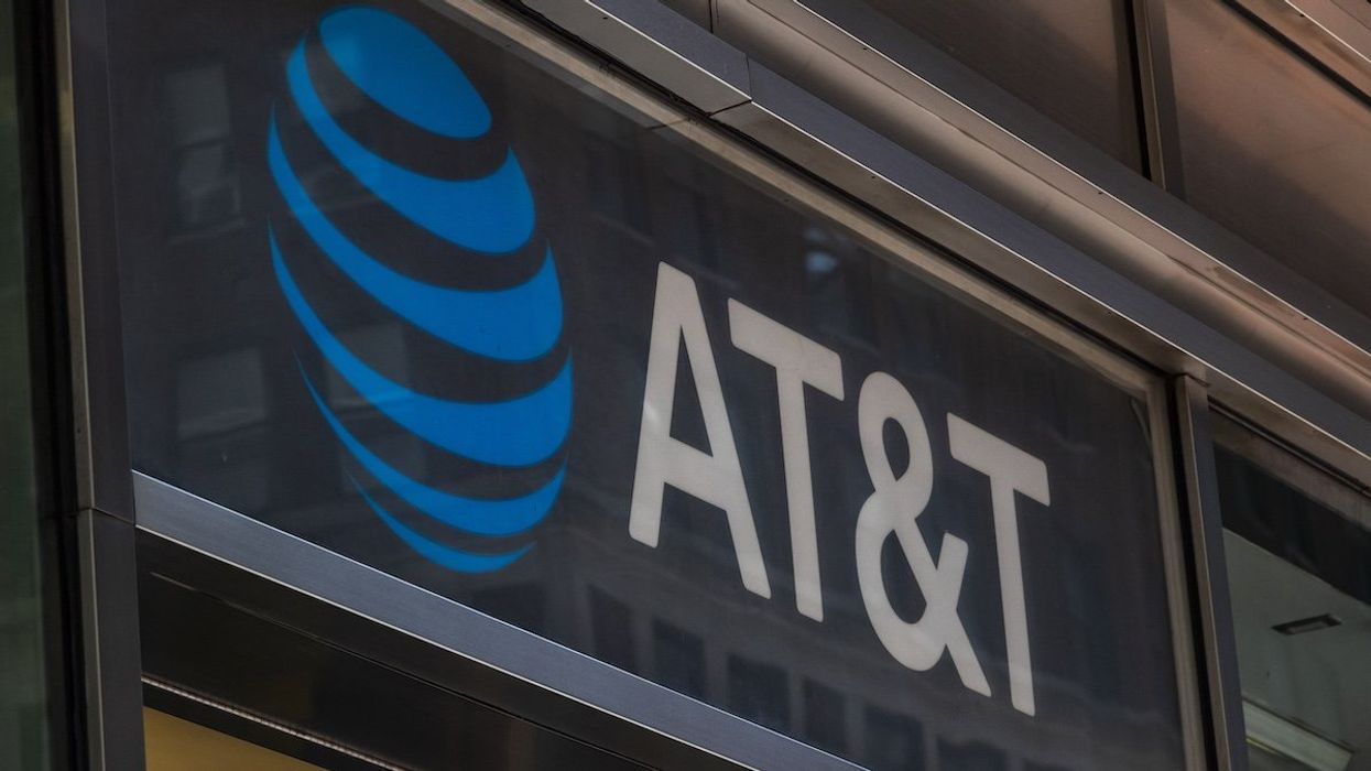 People are passing by an AT&T Inc store in Manhattan, New York City in the US with the company's logo and inscription visible. AT&T Inc. the American Telephone and Telegraph Company is an American multinational telecommunications holding company headquartered at Whitacre Tower in Downtown Dallas, USA. As of March 2024 there was a data breach with leaks of personal data of 73 million customers in the dark web according to the media. NYC, United States of America on May 2023