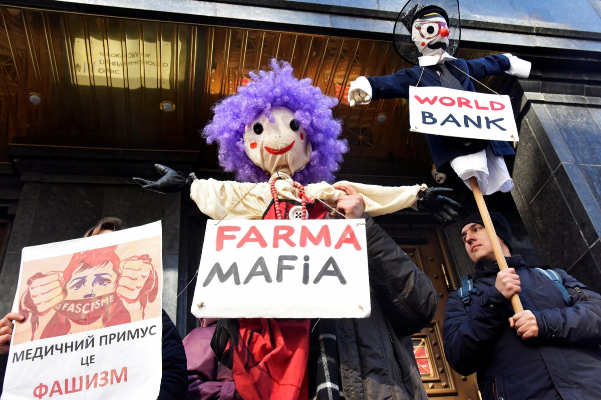 People attend a rally against the use of the Oxford University-AstraZeneca vaccine, marketed by the Serum Institute of India (SII) as COVISHIELD, against the coronavirus disease (COVID-19), outside the Prosecutor General's Office in Kyiv, Ukraine March 3, 2021.