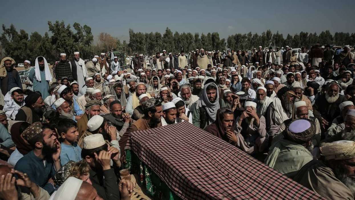 People attend the funeral of a person who was killed in alleged Pakistani airstrikes, in the Ghani Khel district of Nangarhar province.