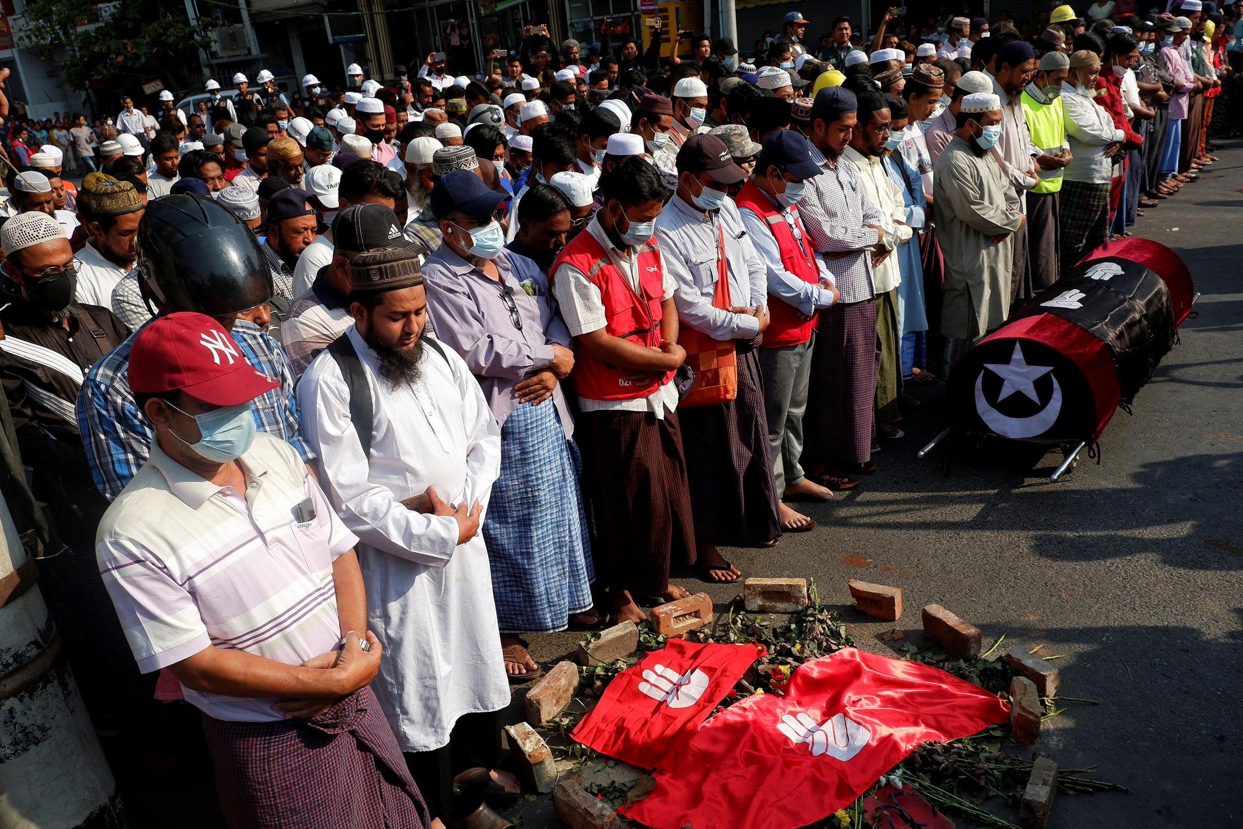 People attend the funeral of a woman who was shot dead yesterday while police were trying to disperse an anti-coup demonstration in Mandalay, Myanmar, March 1, 2021.
