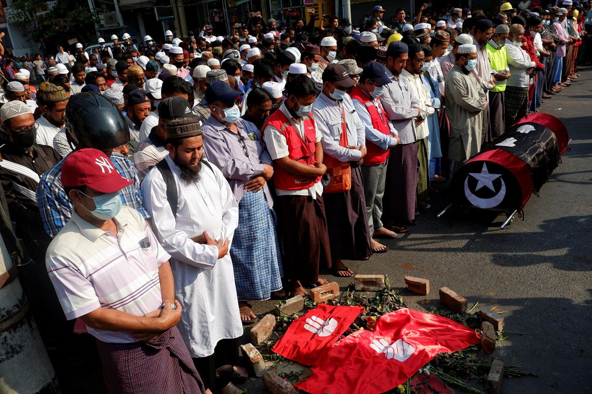 People attend the funeral of a woman who was shot dead yesterday while police were trying to disperse an anti-coup demonstration in Mandalay, Myanmar, March 1, 2021.