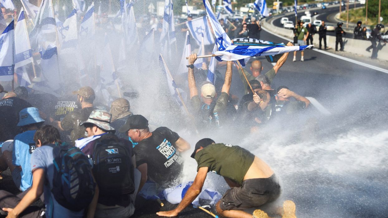 People block a highway to Jerusalem on a day of disturbance to protest against Israeli PM Benjamin Netanyahu and his nationalist coalition government's judicial overhaul.