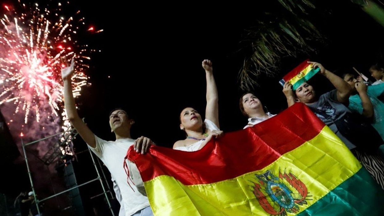 People celebrate after early official results show Bolivian presidential candidate Jorge "Tuto" Quiroga of the conservative Alianza Libre coalition in second place, and as the ruling party Movement for Socialism (MAS) was on track to suffer its worst electoral defeat in a generation, in Santa Cruz, Bolivia, August 17, 2025.