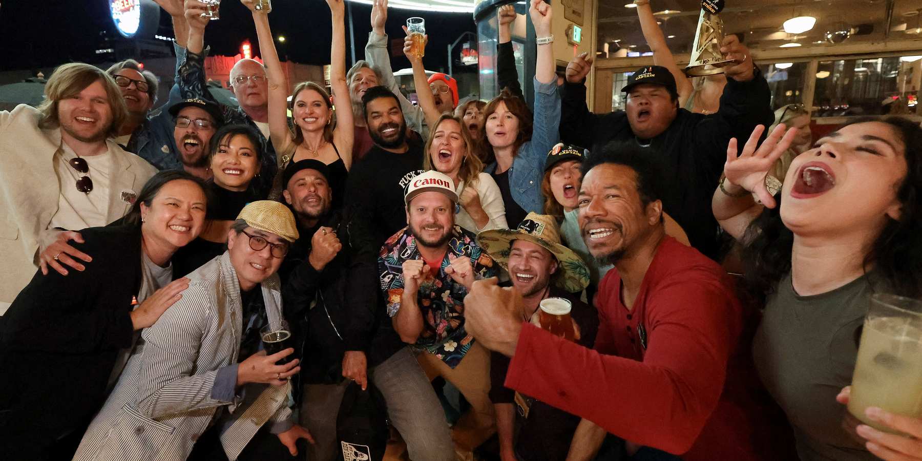 People celebrate after the SAG-AFTRA TV/Theatrical Committee approved a tentative agreement with the Alliance of Motion Picture and Television Producers (AMPTP) to bring an end to the 118-day actors' strike, at a brewery in Los Angeles, California, on Nov. 8, 2023.