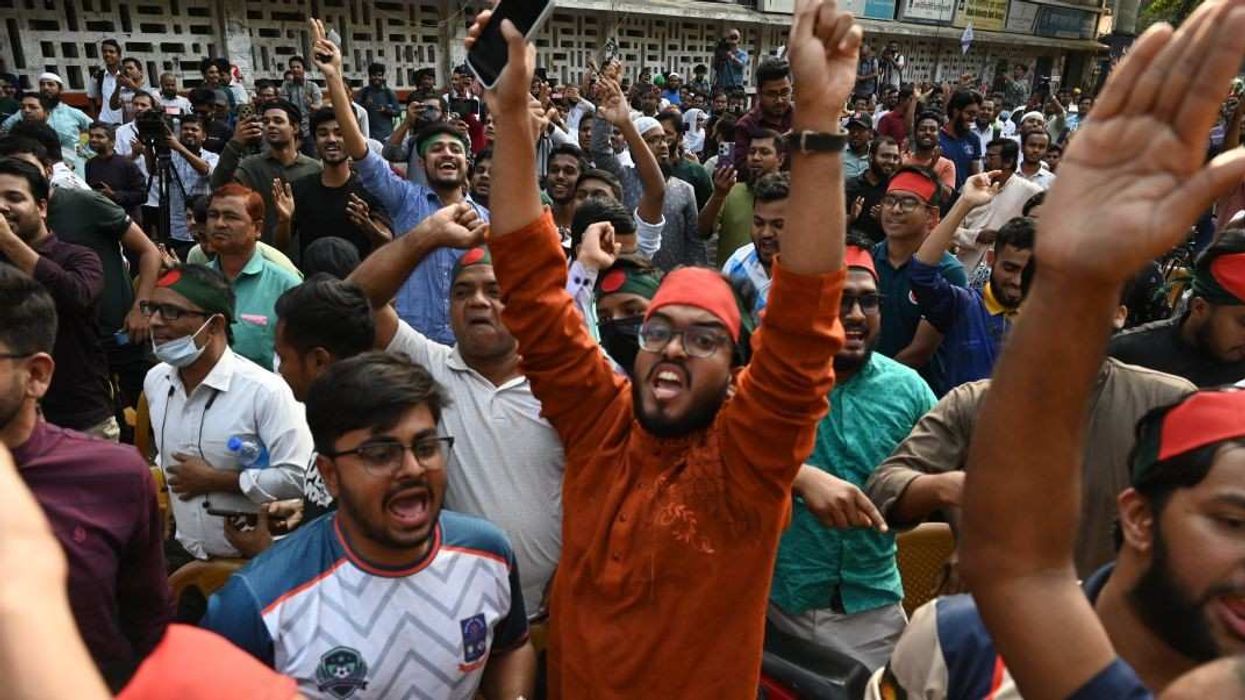 People celebrate the court's verdict after Bangladesh's fugitive former Prime Minister Sheikh Hasina is found guilty and sentenced to death in Dhaka, Bangladesh, on November 17, 2025. The International Crimes Tribunal on November 17 sentences fugitive former Prime Minister Sheikh Hasina to death for crimes against humanity in a murder case of the July uprising.