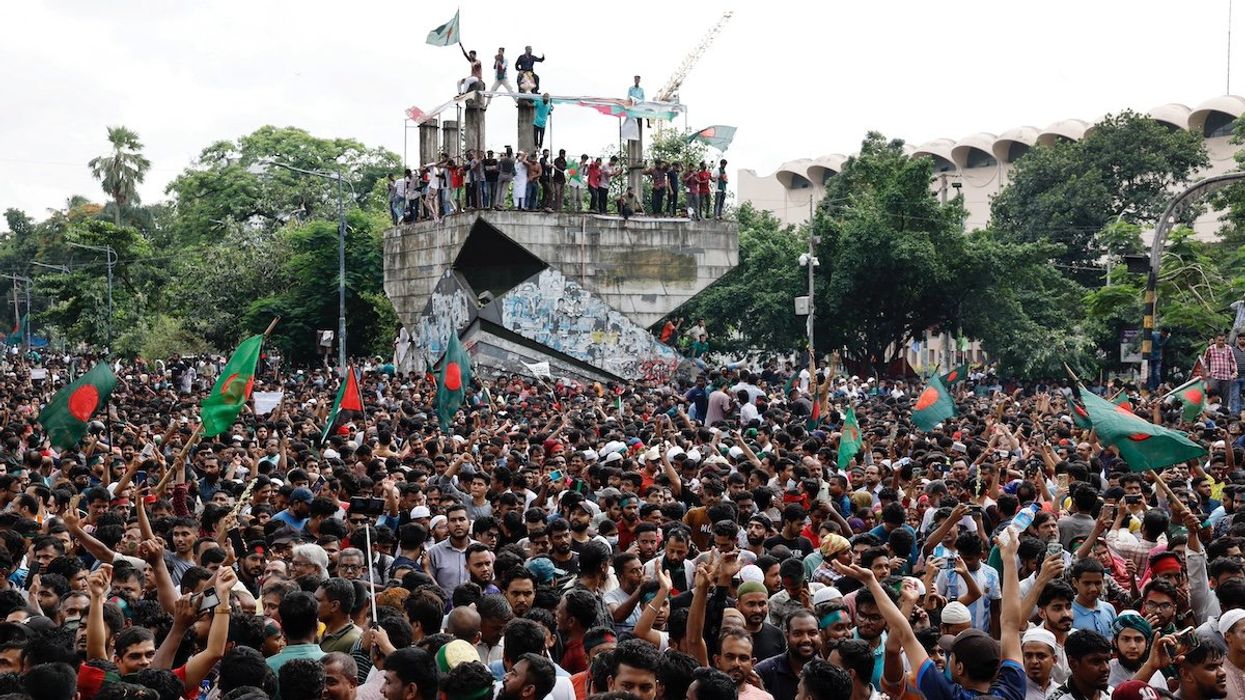 People celebrate the resignation of Bangladeshi Prime Minister Sheikh Hasina in Dhaka, Bangladesh, August 5, 2024.