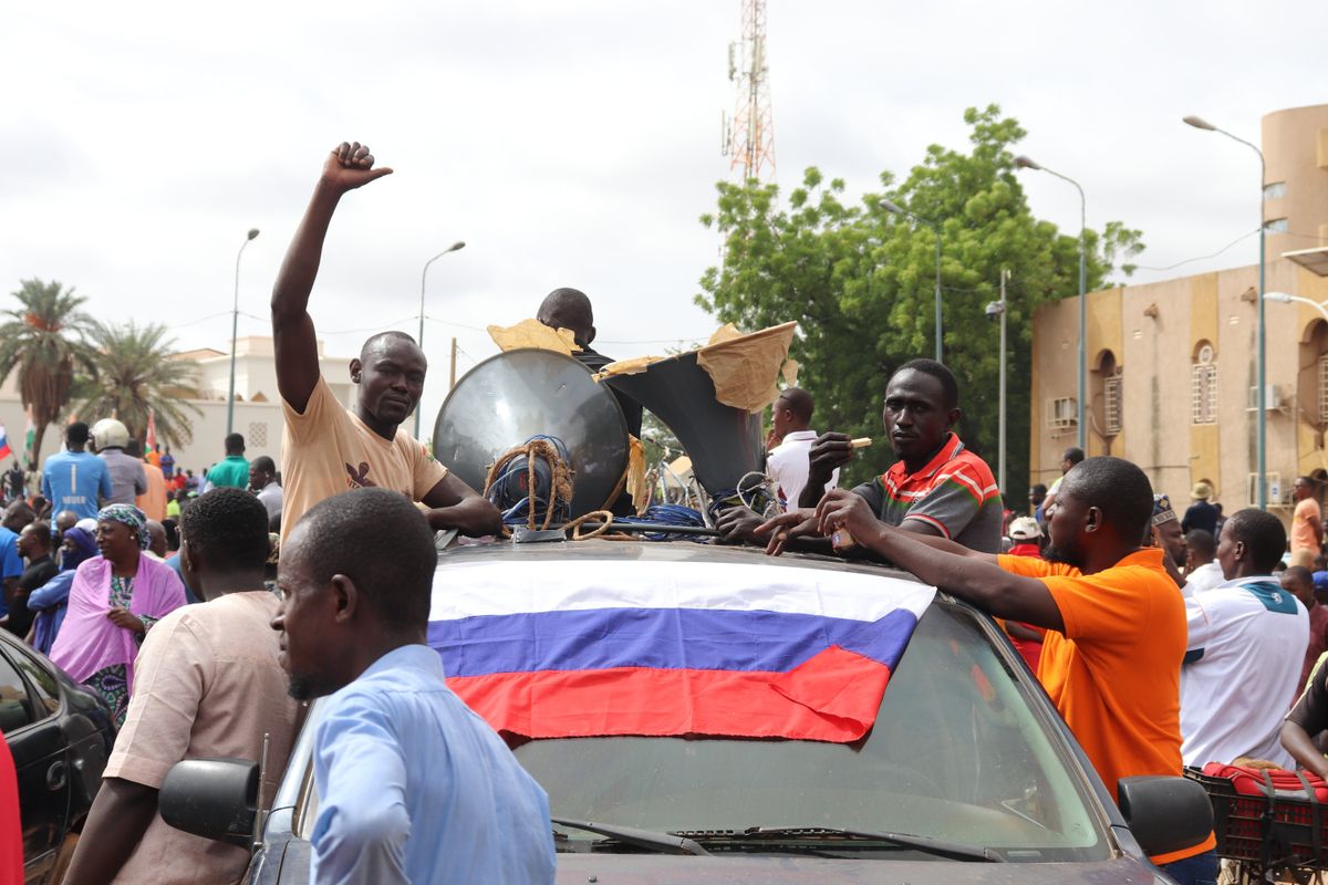 People demonstrate in Niger's capital Niamey to show their support for the coup plotters.