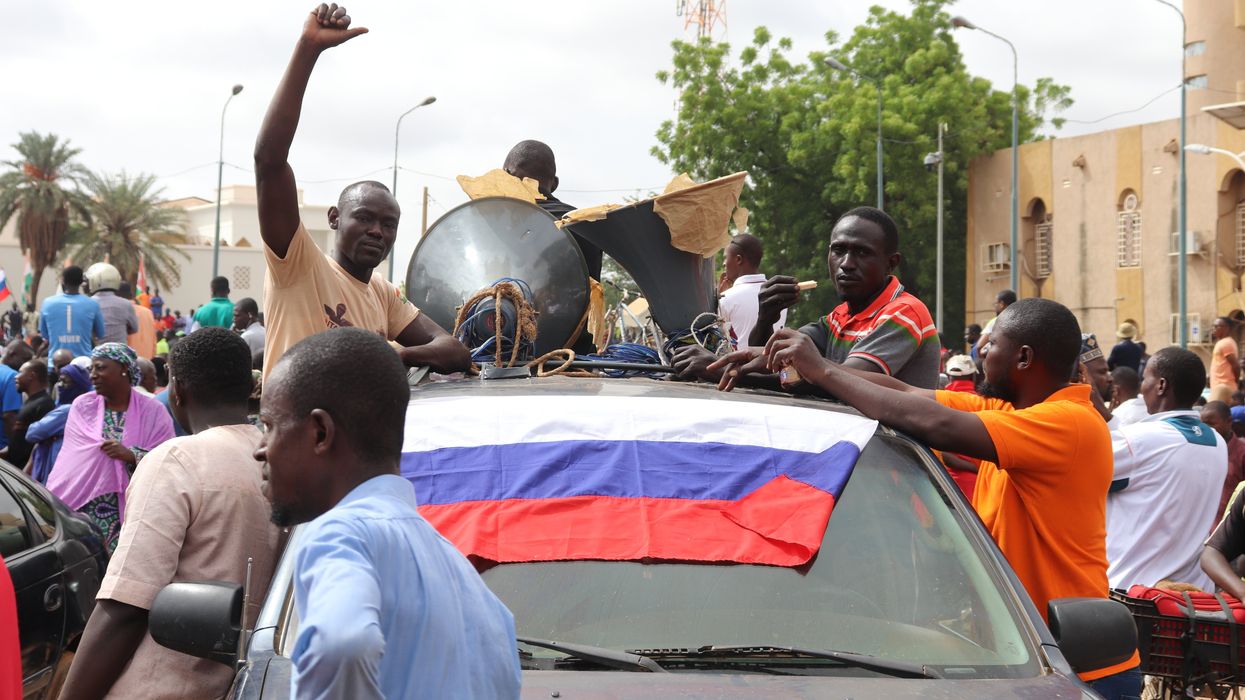 People demonstrate in Niger's capital Niamey to show their support for the coup plotters.