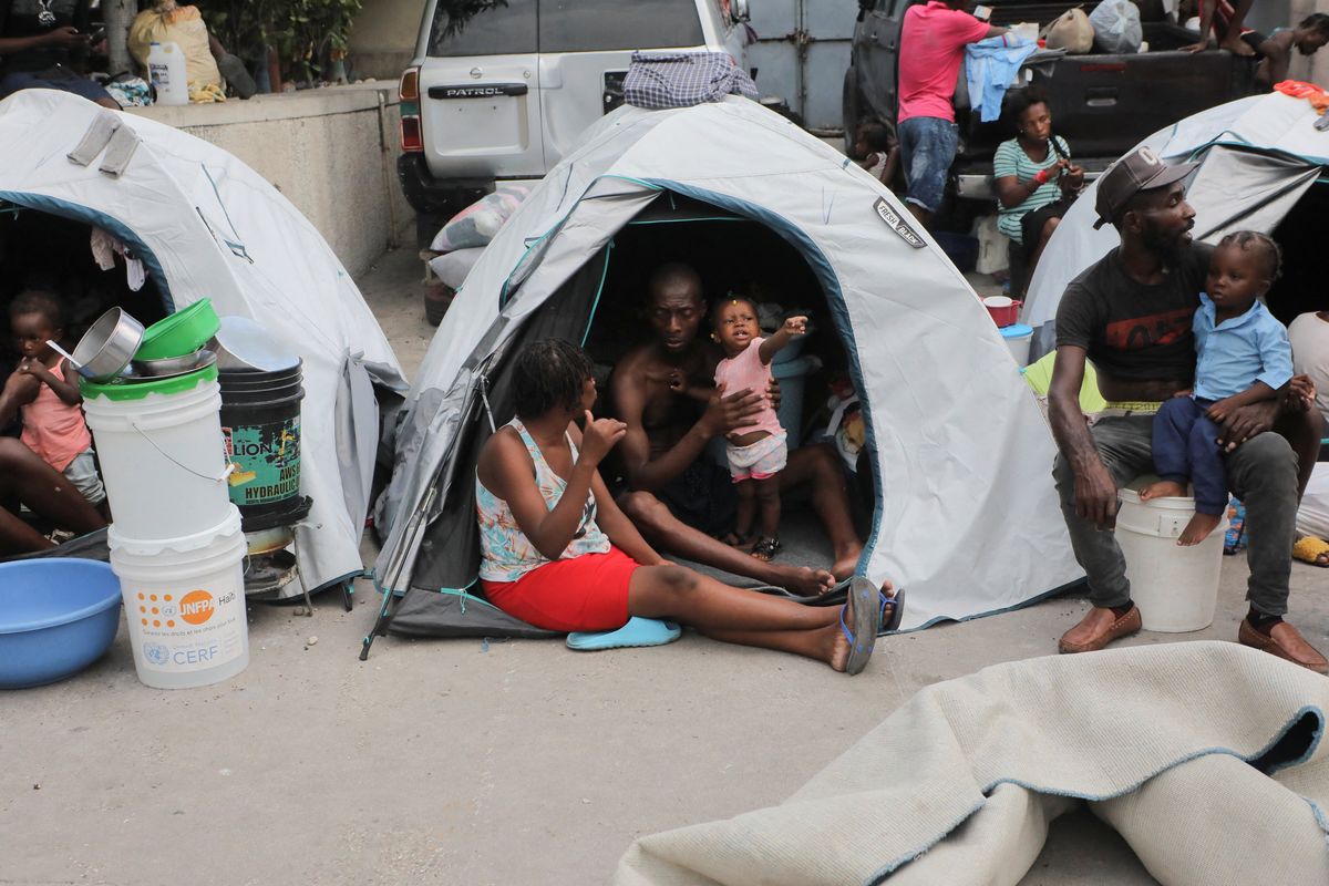 People fleeing gang violence take shelter at a sports arena, in Port-au-Prince, Haiti.