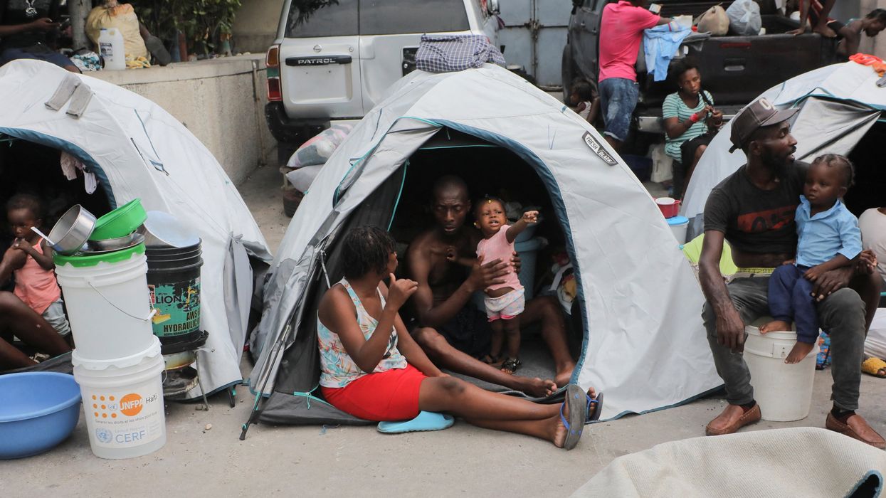 People fleeing gang violence take shelter at a sports arena, in Port-au-Prince, Haiti.