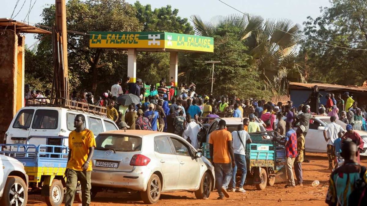People gather at a petrol station in Bamako, Mali, on November 1, 2025, amid a fuel blockade imposed by al Qaeda-linked insurgents.