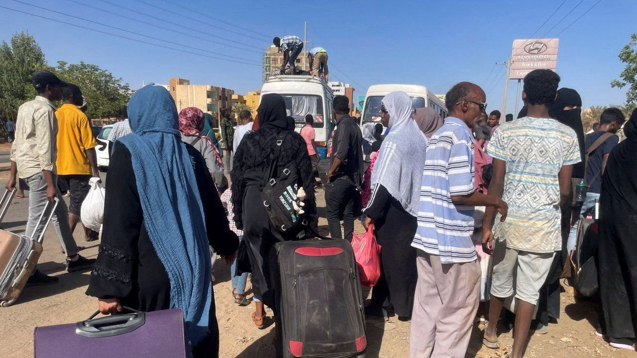 People gather at the station to flee from Khartoum.