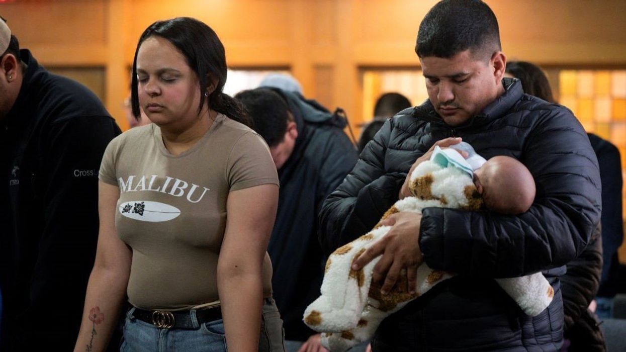 People gather during a service at Starting Point Community Church, which assists members of the newly arrived migrant community, amid concerns of intensified immigration enforcement.