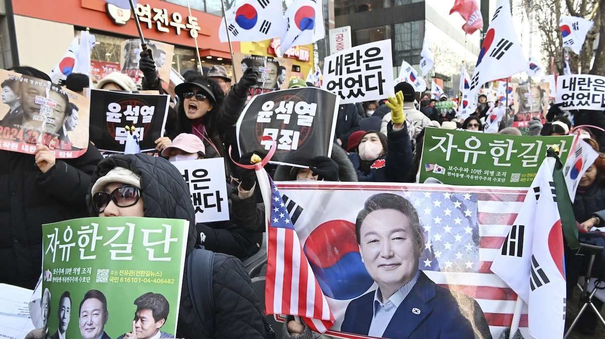 ​People in support of former South Korean President Yoon Suk Yeol rally near Seoul Central District Court in Seoul on Feb. 19, 2026. The court sentenced him to life imprisonment the same day for leading an insurrection with his short-lived declaration of martial law in December 2024. 