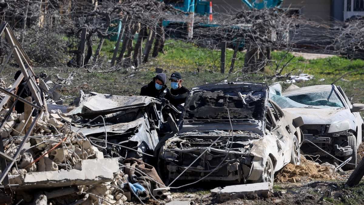 ​People inspect the damage at the site of an Israeli strike on Friday, in Bednayel, Bekaa valley, Lebanon, February 21, 2026. 