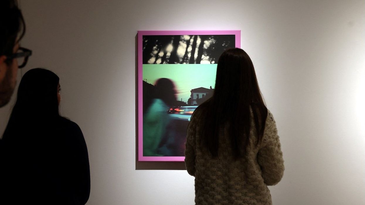 People look at Linda Dounia Rebeiz's 14° 40′ 34.46″ N 17° 26′ 15.14″ W, which is displayed during a preview for a first-ever AI-dedicated art sale at Christie's Auctions in New York City, on Feb. 5, 2025.