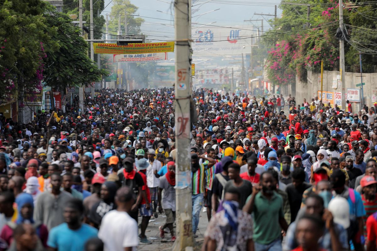 People march during a protest against the government and rising fuel prices, in Port-au-Prince, Haiti 