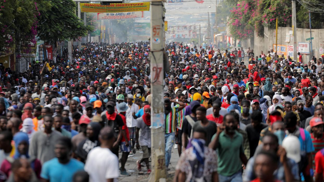 People march during a protest against the government and rising fuel prices, in Port-au-Prince, Haiti